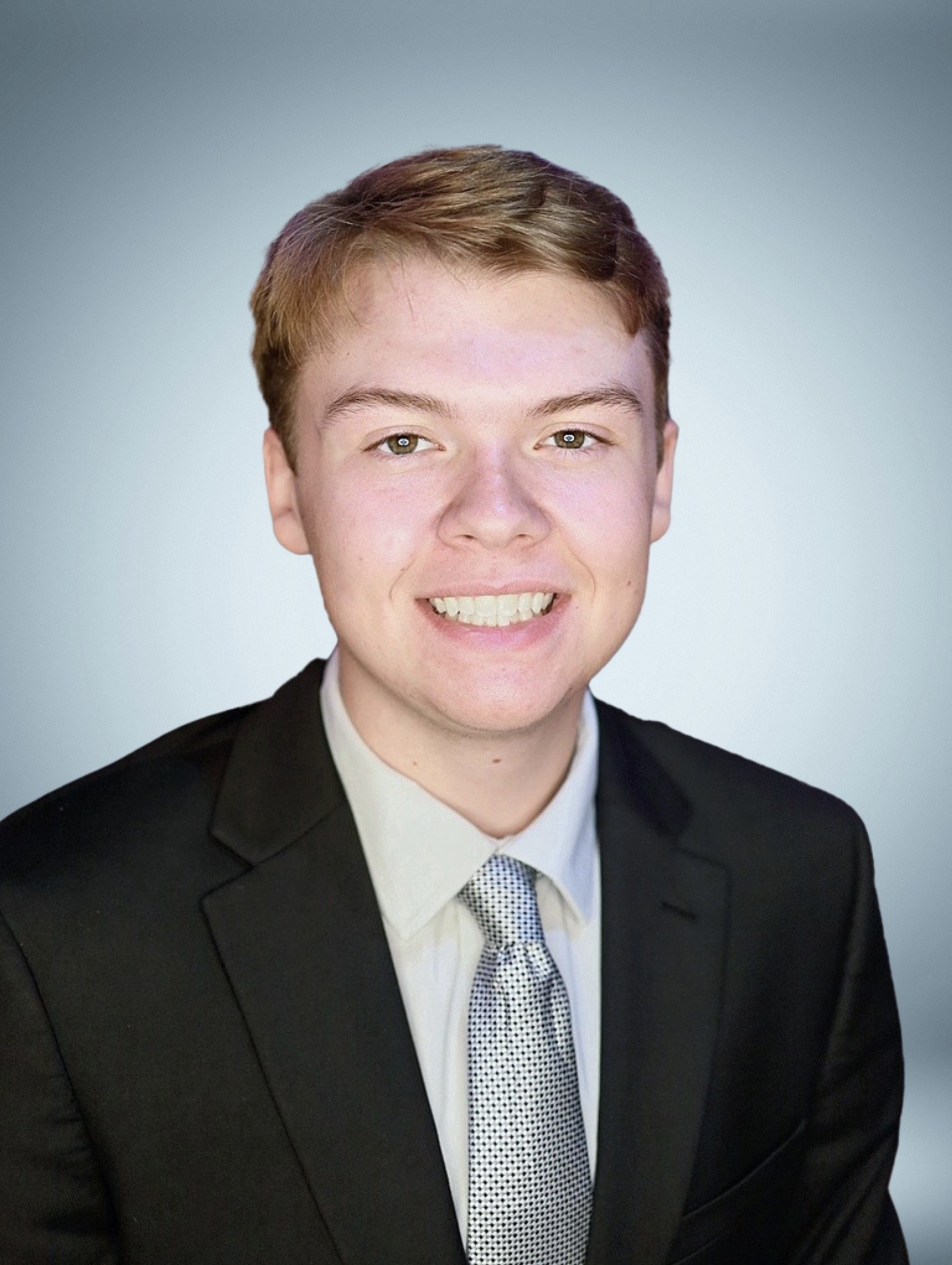 Portrait of Braden in an engineering setting